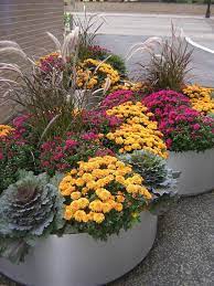 One of the prettiest ways to make a statement and add visual impact to a fall container gardening, flowers ornamental cabbage, ornamental grasses, pansies, mums welcome autumn. Container Gardening Ideas For Autumn Fall Container Gardens Container Flowers Fall Flower Pots