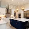 An interesting design with rustic wooden cabinets and an island countertop that merges with the kitchen table. 1