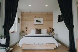 This modern bedroom uses asymmetrically spaced wood strips and gives the whole wall a fresh coat of white for a modern take on the concept that feels so fresh. 36 Wood Accent Walls That Won T Remind You Of Grandma
