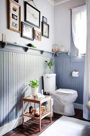 In a small powder room without much access to natural light—for example, a windowless space under the stairs—embrace the moodier, edgier atmosphere with the original wainscoting was painted in farrow & ball's plummet, which complements the paper and makes the powder room feel more formal. 10 Bathroom Wainscoting Ideas Photos Of Pretty Wainscoted Bathrooms Apartment Therapy