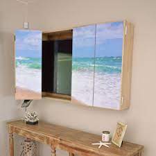 I used three in stock brown maple home depot upper kitchen cabinets (30 wide x 18 high x 12 deep), plywood, bead board, 1x2 & 1x3 boards and some decorative moulding! Diy Wall Mounted Tv Cabinet With Free Plans H2obungalow