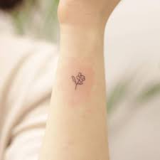 50 flattering minimalist tattoos to exude charm and confidence. Minimalist Flower Tattoo On The Wrist