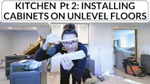 Installing kitchen cabinets on unlevel floor. Kitchen Pt 2 Installing Cabinets When Floor Isn T Level Farmhouse Sink Cutout Youtube