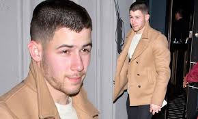 Nick Jonas bundles up as he leaves a restaurant in WeHo