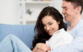 Download Side View Of Happy Couple On Sofa At Home For Free Couples Couples In Love Happy Couple