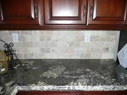Choose a tile made of natural stone to emphasize the inherent and simple beauty of nature. Natural Stone Subway Tile Backsplash Re Dark Counters Tumbled Stone Subway Tile Backsplash Photos Stone Tile Backsplash Stone Backsplash Kitchen Remodel