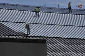 Apply the metal etching primer to the rusted galvanized metal roof, using the roller. Can I Paint My Metal Roof To Change Its Color
