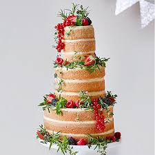 Beautiful wedding cake with guinea fowl feathers, traditional shield, spear and knobkerrie. Alternative Wedding Cakes Recipes M S