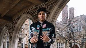 Amazon advertising find, attract, and engage customers: Nle Choppa Is Standing In Buildings Background Wearing Black Dress Hd Nle Choppa Wallpapers Hd Wallpapers Id 73730