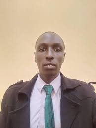 Dr. Daniel Mutai, former principal at RVIST in Nakuru City, presenting a  bronze medal he won during the 5th Edition of the World Federation of  Colleges and Polytechnics Awards of Exellence 2022