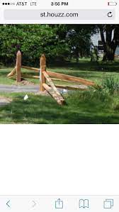 Gallery featuring images of 28 split rail fence ideas for residential homes, a selection of beautiful, rustic fences that don't cost a fortune. Split Rail Drive Way Entrance Drive Entrance Flowergardenideasinfrontofhouseentran Landscaping Entrance Driveway Entrance Landscaping Driveway Landscaping