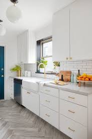 white cabinets with gold hex knobs