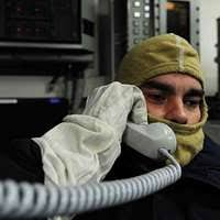 A US infantryman gives the "The Thumbs Up" sign during his participation in  Operation URGENT FURY. He is carrying a 90 mm M67 recoilless rifle