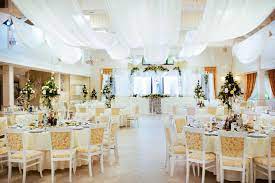 A beautiful wedding table setting in silver and white with ornate wine glasses and damask patterned linens. Table Layout Of A Wedding Reception Lovetoknow