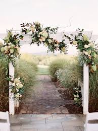 Elegant Outdoor Wedding Ceremony Decor White Wedding Arch With Greenery Ceremony Decorations Outdoor White Wedding Arch Wedding Ceremony Decorations Outdoor