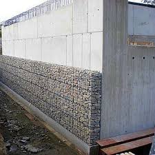 Latvanyos Homlokzatburkolat Kovekkel Toltott Drotkosarakbol Grand Designs Houses Exterior Design Building Design