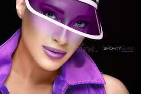 Sporty Beauty. Fashionable Young Woman in Purple Sun Visor Stock Photo