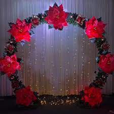 Poinsettia Arch For Christmas Parties Decor And Photo Booth Poinsettia Christmasdecor Christmaspar Flower Wall Christmas Party Decorations Giant Flowers