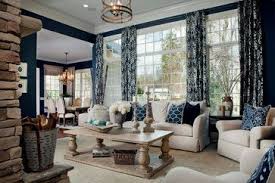 This Navy And Ivory Living Room Is Stunning I Love The Pops Of Blue The Stone Fireplace Navy Living Rooms Transitional Living Room Design Taupe Living Room