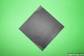 Trace an oval shape onto the black construction paper. How To Make A Penguin Out Of Paper Easy Origami Penguin Instructions