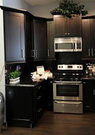 Espresso Cabinets With Dark Countertop That Runs Up As Backsplash Dark Countertops Backsplash With Dark Cabinets Kitchen Countertops Laminate