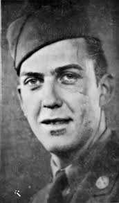 The flag-draped body of Maj. Thomas Howie rests