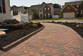 Although brick walkways are often associated with cottage style, they actually work well with a variety of design styles. Red And Black Brick Pavers Novocom Top