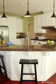 Wood Kitchen Cabinets Updated To White Dark Handles Used With Stainless Steel Appliances Good L White Kitchen Makeover Wood Kitchen Cabinets Kitchen Remodel
