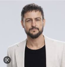 Does he look better with or without a beard?