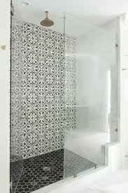 Well Appointed Walk In Shower Boasts A Round Vintage Brass Shower Head Mounted Over Black Hex Floor Tiles Co Bathrooms Remodel Shower Tile Bathroom Shower Tile