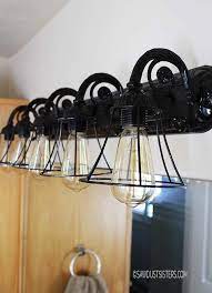 Vanity lights are essential to bathrooms for many reasons. 16 Brilliant Lighting Ideas You Can Diy On A Dime Diy Light Fixtures Bathroom Light Fixture Makeover Lighting Makeover