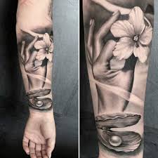 hawaiian theme hand and flower tattoo black and grey realistic work by csaba tattoo anansi artist munich germany hawaiian tattoo tattoos black and grey tattoos