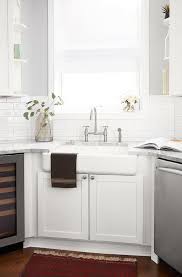 The sink can be unsightly at times—full of random stains and stray dishes—so it's smart to place it in the far corner of the kitchen, where it's least likely to be seen by guests. Corner Sink Design Ideas