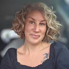 Who can cut curly hair near Hendersonville?