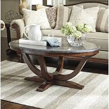 Signature Design By Ashley Balinder Medium Brown Oval Cocktail Table You Can Get More Details B Coffee Table Coffee Table With Shelf Coffee Tables For Sale