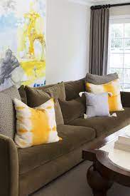 Bringing style along with joyfulness, thus enlivening the space, this yellow chesterfield couch will be. Brown Sofa With Yellow Pillows Contemporary Living Room