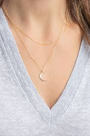 Available in sterling silver, 14kt gold plated over sterling silver and this pretty moon necklace is from the etsy shop, tangerine jewelry shop, and comes in three different lengths. Delicate Moon Necklace Crescent Moon Necklace In 14k Gold Fill Sterling Silver Rose Gold Fill Simple Moon Ne Moon Necklace Floating Necklace Gold Necklace