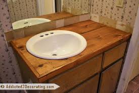 Follow these steps to remodel your bathroom countertops using tile. Bathroom Makeover Day 2 My 35 Diy Wood Countertop Addicted 2 Decorating