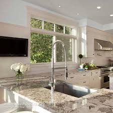 Alaska white granite from brazil is a beautiful blend of palest silver and frosty whites highlighted with neutrals and onyx hues that glitter with a warm glow in sunlight and under kitchen lighting. Alaska White Granite Countertops In Va Md Washington D C Brown Granite Countertops Marble Kitchen Inspiration White Granite Countertops