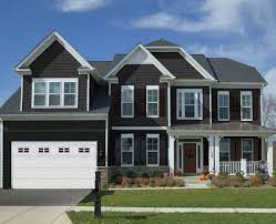 What is the most popular style of vinyl siding? Manor A Bold Dark Color Vinyl Siding From Kp Vinyl Siding Learn More About This Color See Our Favorit Grey Siding House House Siding Exterior House Colors