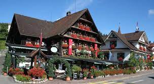 great example of restaurant curb appeal using the colors of flowers to attract new patrons notice the place is p lake lucerne switzerland hotel swiss chalet