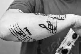 Geometric lines tattoo on guys arm, shoulder and back. 50 Music Staff Tattoo Designs For Men Musical Pitch Ink Ideas