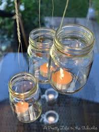 One mason jar candle holder provides a soft, warm glow while a group of them can be hung outdoors from hooks or tree branches to provide light and when hanging the mason jar is not an option, you can still use the candle holder on a table or counter. 94 Hanging Candleholders Vases Ideas Hanging Candle Holder Candles Hanging