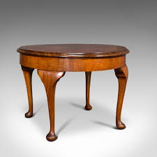 Many of the coffee tables in our guide come with storage space, ideal for hiding away living room clutter, or indeed for hiding away cocktail paraphernalia. Antique Edwardian English Round Table In Walnut 1910s For Sale At Pamono