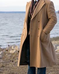 I am talking about the polo coat, a double breasted outwear garment, usually made of wool or cashmere, with belt. Gotham Red