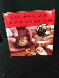 This roaster is shaped like a garlic bulb and holds one large or two medium bulbs of. Cast Iron Garlic Roaster And Squeezer 1963920457