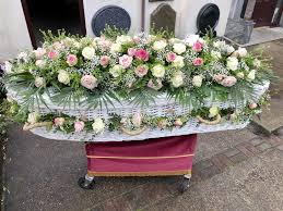 Titan offers the best wicker caskets at the lowest prices. Wicker Coffin Flower Garland Funeral Flower Arrangements Funeral Flowers Funeral Caskets
