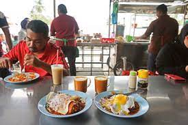 Roti canai or roti paratha is a crispy indian flat bread found in malaysia. Penang Gemas Road Roti Canai Asia Pacific Hungry Onion