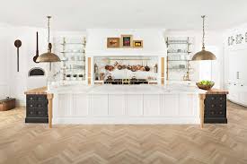 Very nice, white angled peninsula bar height wood hood. Most Beautiful All White Kitchens Archives Happy Haute Home