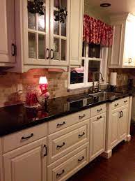 The speckled granites with pink, peach, gold or brown will dictate your whole kitchen color scheme. A Backsplash Is Used In Order To Protect The Wall From Splashes It Is Usually Instal Antique White Kitchen Cabinets Antique White Kitchen New Kitchen Cabinets